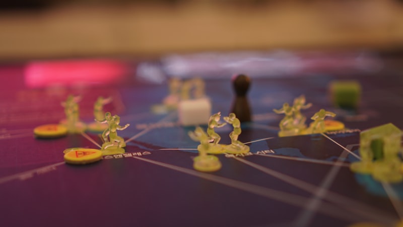 a close up of a board game with people on it