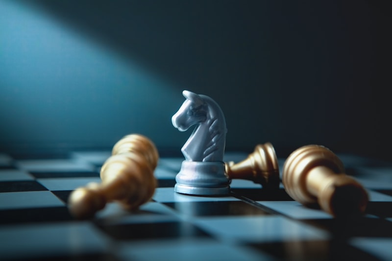 A white knight chess piece stands over fallen gold pieces.