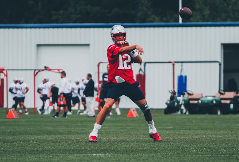 football players in red and white jersey shirt