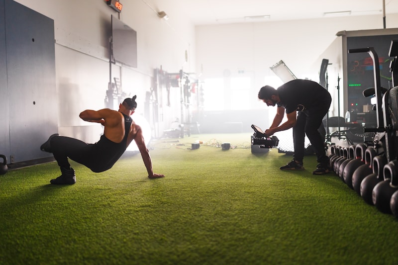 A man and a woman doing exercises in a gym