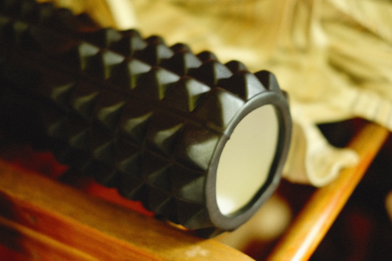 a close up of a black object on a wooden table