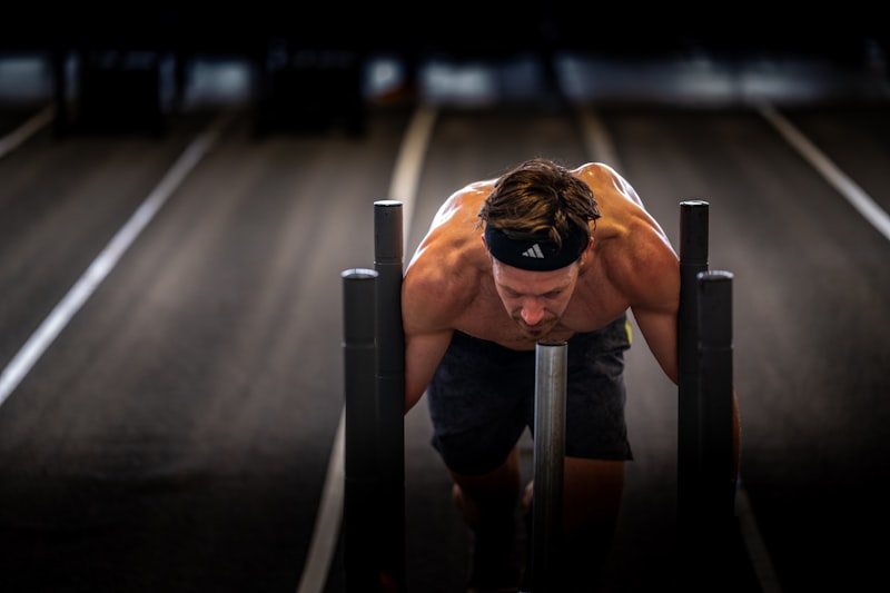 A man is doing push ups on a bench