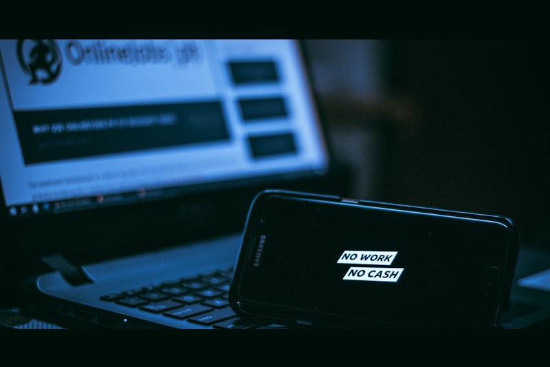 black asus laptop computer on brown wooden table