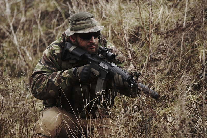 soldier holding black assault rifle