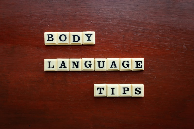 two scrabble tiles spelling body language tips