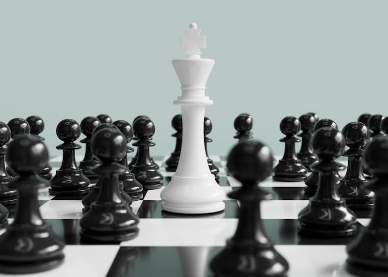 White king stands surrounded by black pawns.