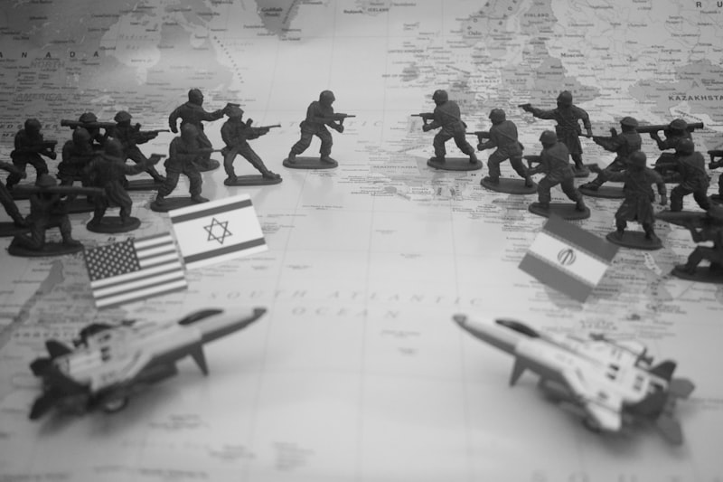 Toy soldiers and flags on a world map