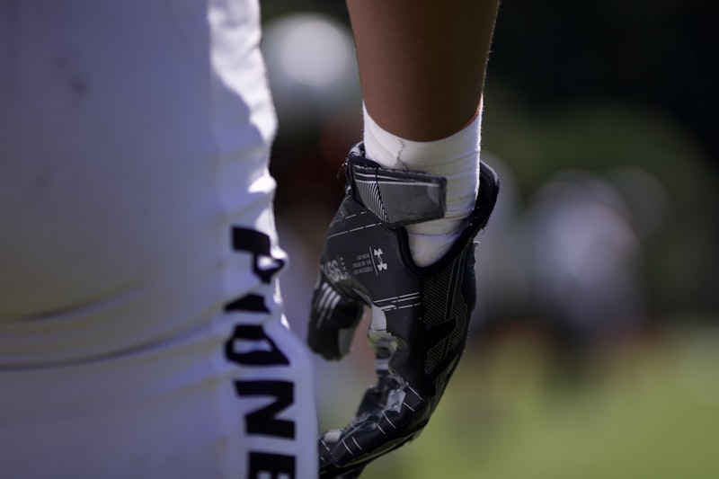Close-up of a football player's hand with glove.