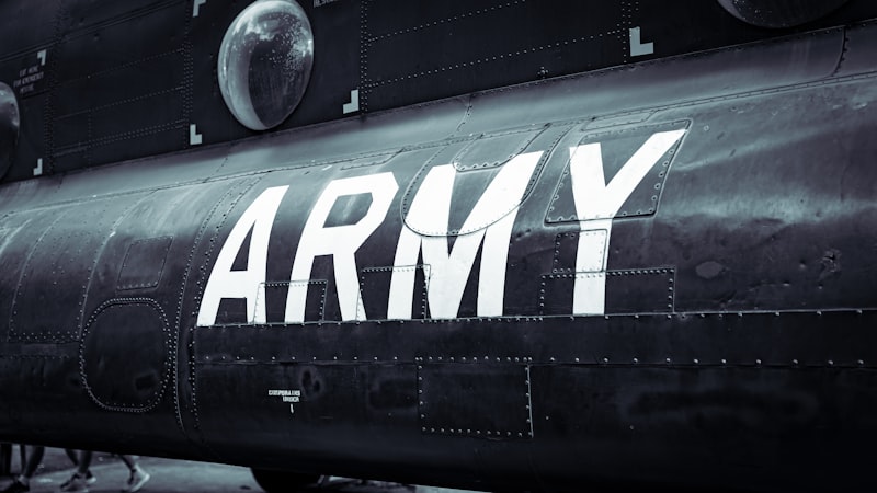 a black army plane with the word army painted on it