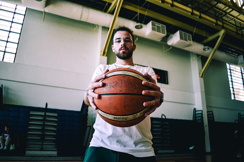 a man holding a basketball